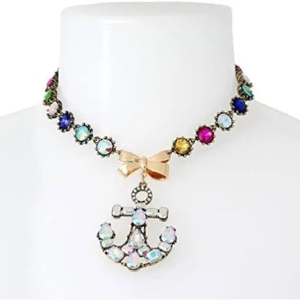 Betsy Johnson  round stone necklace featuring bow at front with anchor pendant